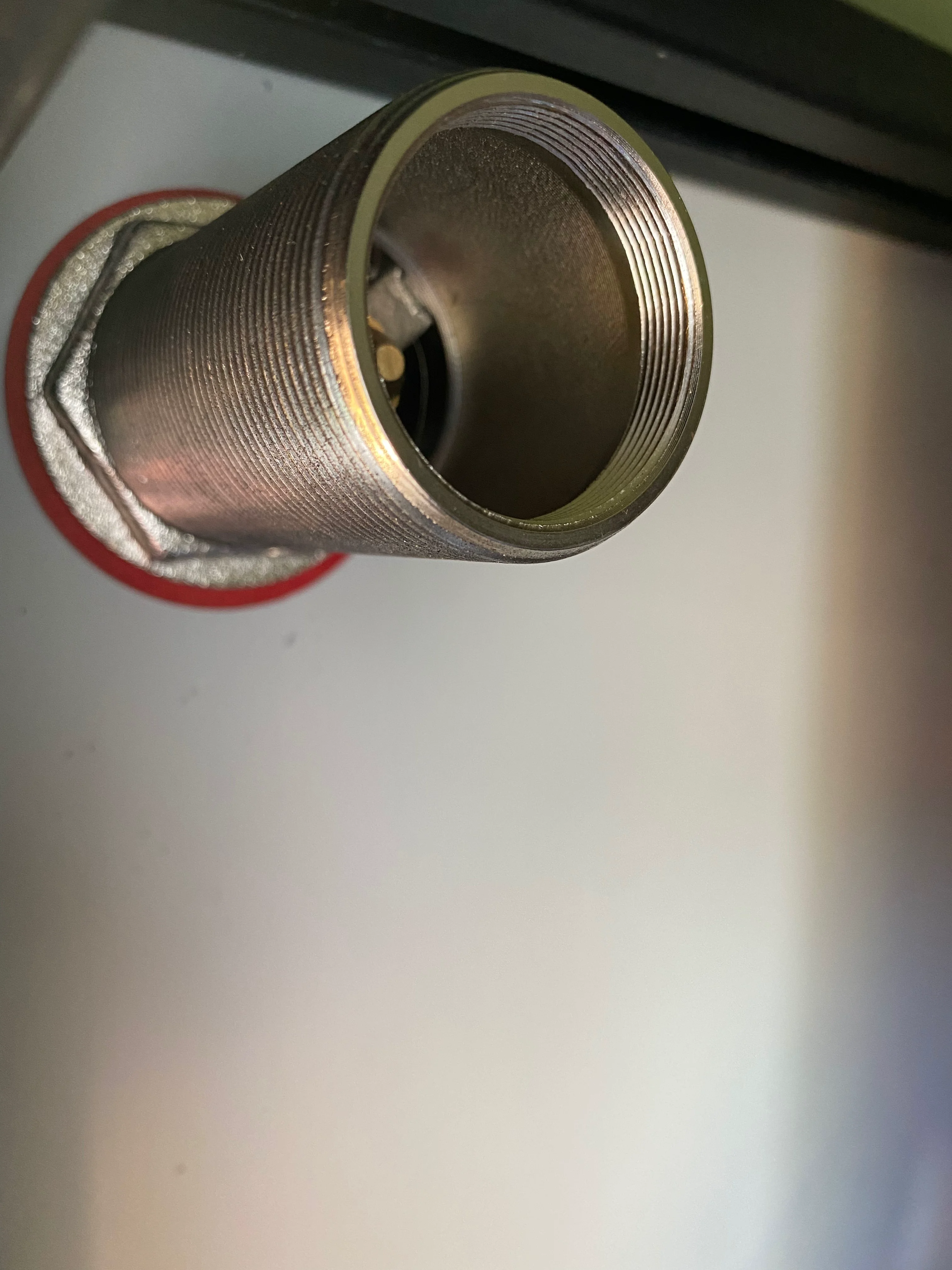 Threaded drain fitting showing filter adaptability